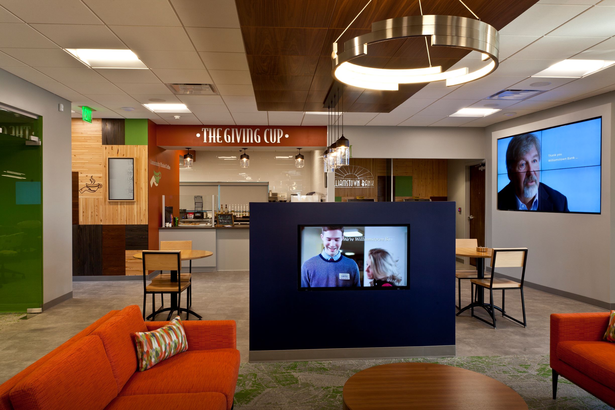 The customer lounge is filled with technology that displays branded Williamstown Bank content